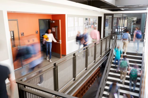 Students moving in school hallway